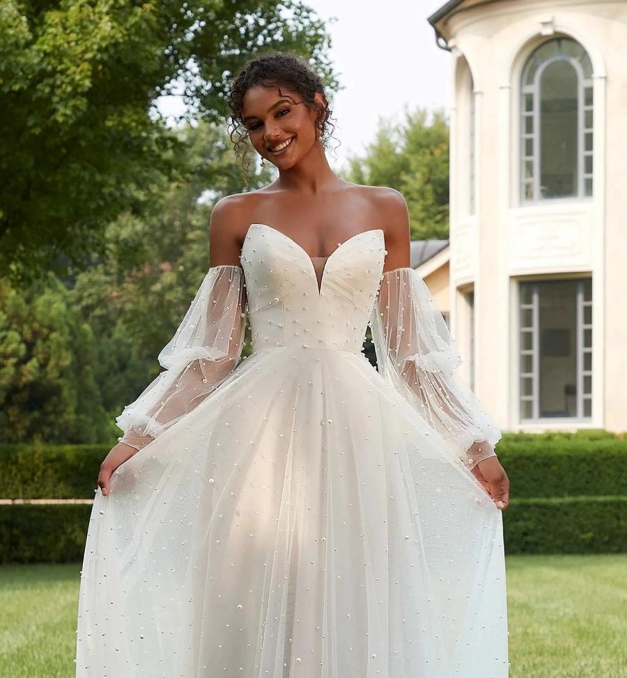 Photo of Model wearing a Morilee Bridal Gown